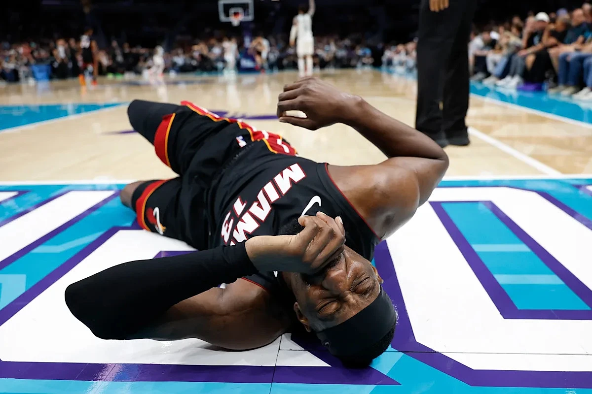NBA play-in: Heat's Bam Adebayo leaves with back injury after Hornets' LaMelo Ball grabbed his ankle on fall to ground